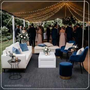 Lounge setting with royal blue chairs and ottomans for hire